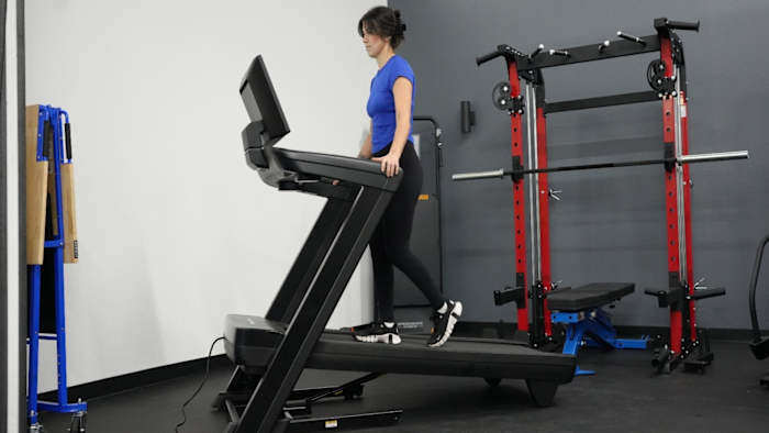 Woman walking on incline on NordicTrack 1750